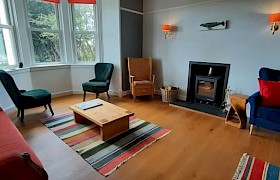 spacious sitting room with view of the garden